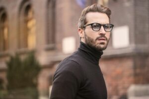 men,A fashionable man with glasses and a beard captured outdoors in Budapest.